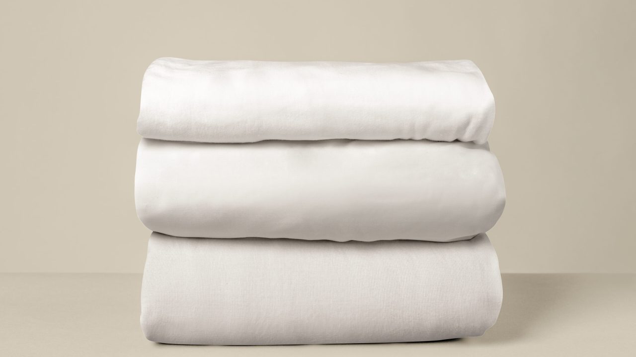 Stacked white bed linen Stacked white bed linen