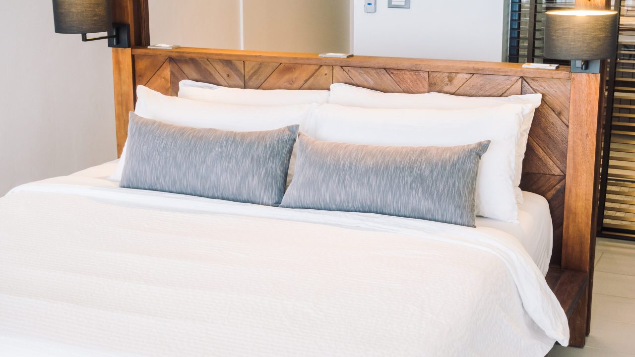 White pillow on bed Beautiful luxury white pillow on bed decoration in bedroom interior - Vintage Light Filter